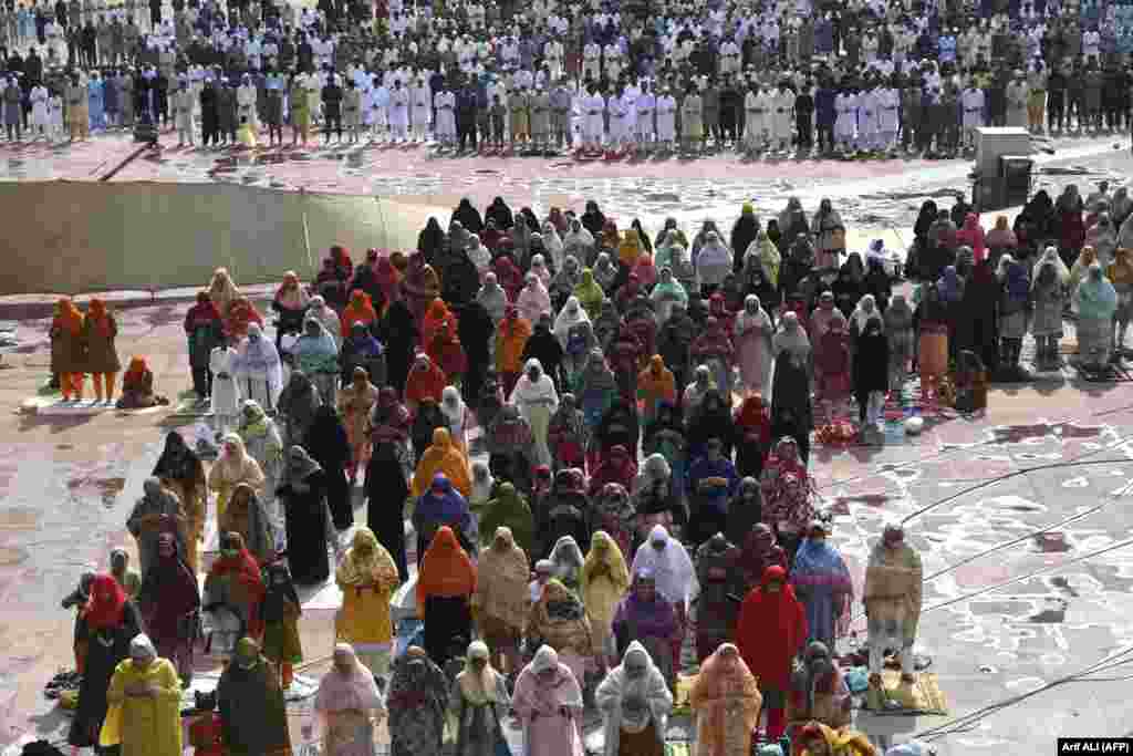 Muslim devotees offer prayers at the Badshahi Mosque in Lahore, Pakistan.