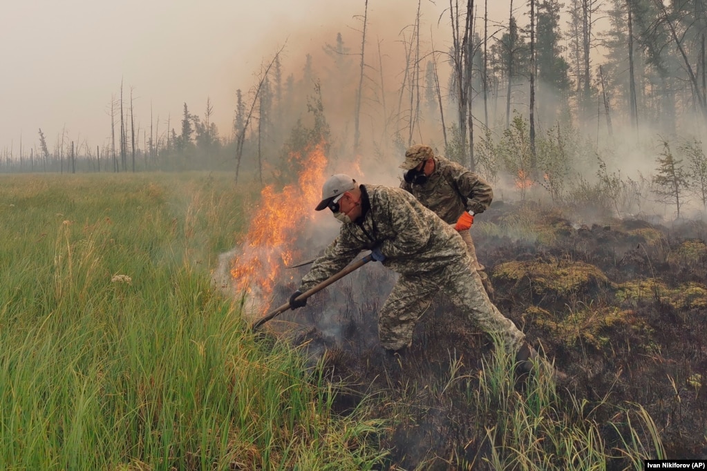Volunteers battle the flames in the Yakutia region.