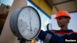 A pressure gauge is seen at a gas compressor station in the Ukeaine.