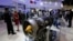 Visitors tour the Motor Sich display booth showcasing their engines at an aviation expo in Beijing. (file photo)