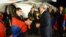 Armenian President Serzh Sarkisian (right) greets members of the Armenian men's chess team at Yerevan's Zvartnots airport.