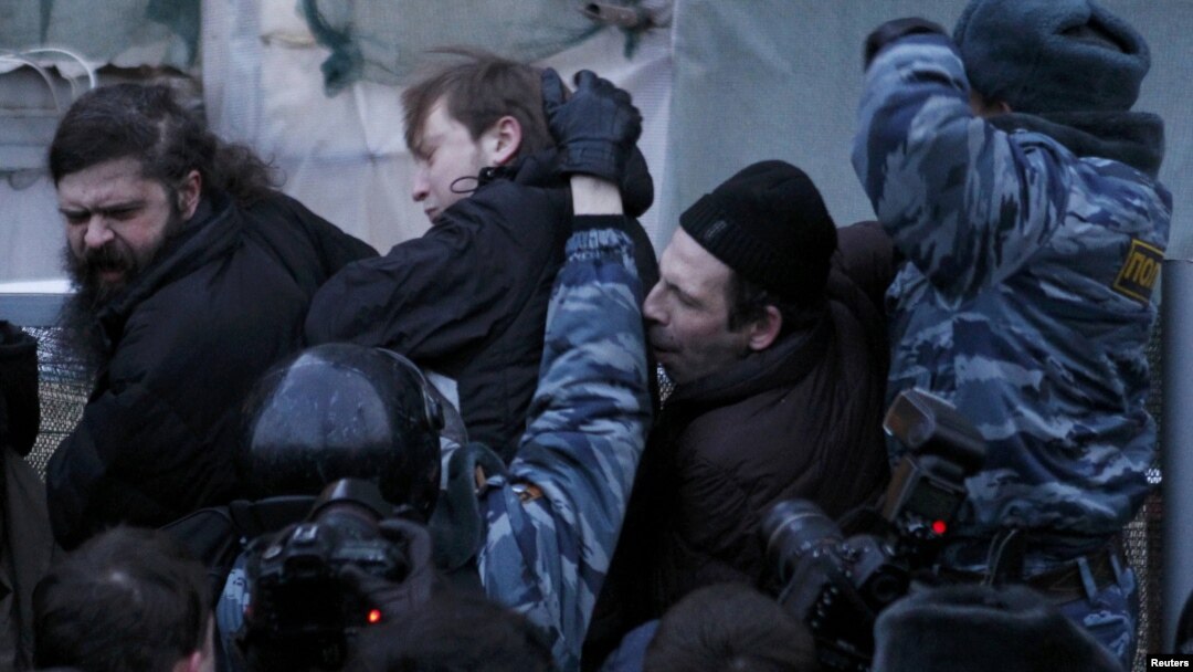 Russian police tussle with participants in an opposition rally in central Moscow on March 5.