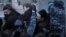 Russian police tussle with participants in an opposition rally in central Moscow on March 5.