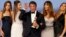 Sylvester Stallone and his wife Jennifer Flavin (2nd R) and their daughters, Sistine (L), Scarlet, (2nd L) and Sophia, pose with his award for Best Performance by an Actor in a Supporting Role in any Motion Picture for his role in "Creed" backstage at the