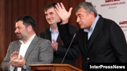 Georgian Party leaders Erosi Kitsmarishvili, Sozar Subari, and Levan Gachechiladze (left to right) announced the new bloc in Tbilisi on October 12.