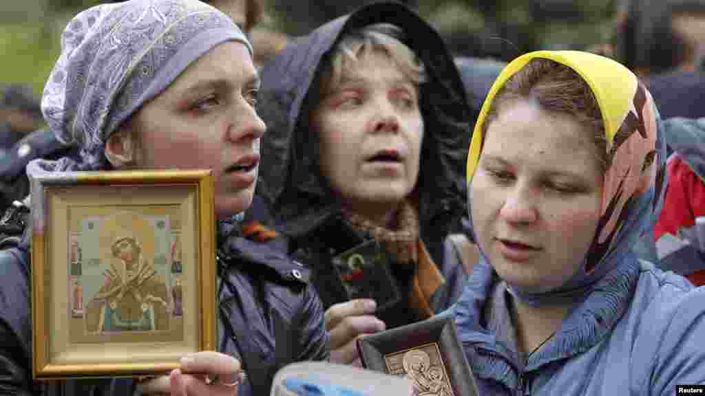 Orthodox believers gather outside the court building during the October 1 hearing.