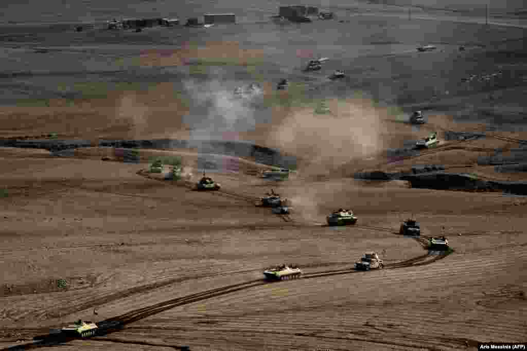 A convoy of Iraqi Army vehicles roll towards Mosul on February 27. The U.S.-backed, Iraqi-led coalition consists of approximately 100,000 troops and is the largest mobilization of Iraqi forces since the U.S. invasion of 2003.&nbsp;