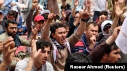 Family members and relatives chant slogans during a protest to condemn the April 12 attack on the Hazaras in Quetta's fruits and vegetable market. 