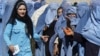 Afghan widows wait to receive monthly rations from the World Food Program in Kabul on October 26.<br /><br />Photo by Omar Sobhani for Reuters