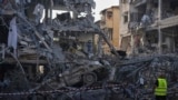 Israel - Israeli security forces inspect destroyed residential buildings that were hit by a missile fired from Iran, in Ramat Gan, near Tel Aviv, Israel, on Saturday, June 14, 2025.
