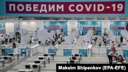 RUSSIA -- People wait to receive a shot of Russia's Sputnik V vaccine against COVID-19 disease at a vaccination center in Gostinny Dvor, a huge exhibition place in Moscow, July 15, 2021