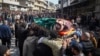 Relatives and neighbors attend the funeral procession for four Syrian security force members killed in clashes with loyalists of ousted President Bashar al-Assad in coastal Syria on March 8.