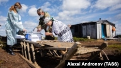 Residents of a remote Khanty cattle camp take part in early voting on the constitutional amendments on June 25.