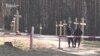 WATCH: Police in Belarus have detained at last 15 activists who protested against the removal of dozens of wooden crosses from the Kurapaty memorial site commemorating victims of Soviet-era repressions.