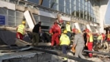 Emergency and rescue personnel work at the site where a concrete outdoor roof of a train station collapsed in the northern Serbian city of Novi Sad on November 1, 2024. 