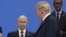 U.S. President Donald Trump (right) looks at Russian President Vladimir Putin as they take their places for a photo during the Group of 20 summit in Buenos Aires in 2018. 
