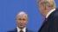 ARGENTINA – US President Donald Trump (R), looks at Russia's President Vladimir Putin as they take place for a family photo, during the G20 Leaders' Summit in Buenos Aires, on November 30, 2018