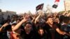 People gather during a protest near the government office in Basra on September 6. 