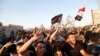 People gather during a protest near the building of government office in Basra, Iraq September 6, 2018. 