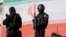 Members of the Iranian police attend a pro-government rally in Tehran on January 12