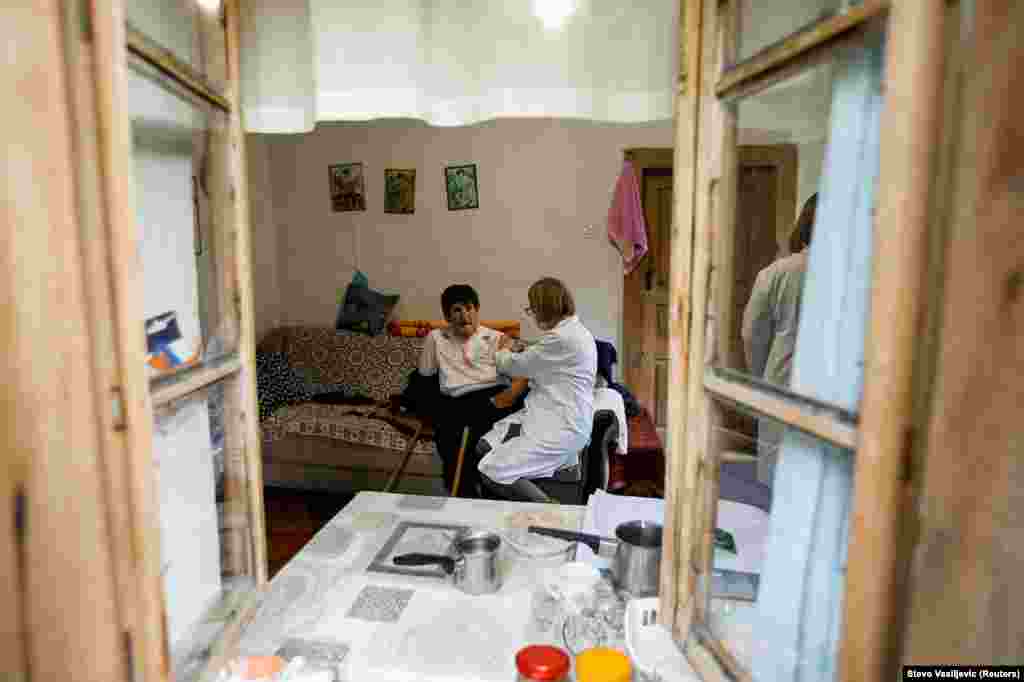 An elderly woman receives the vaccine. More than 1,500 people have died from the coronavirus in Montenegro since the pandemic was declared in early 2020.