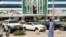 A man walks past a banner of Saudi Crown Prince Mohammed bin Salman displayed on a commercial building in Riyadh. 