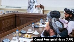 ملا حسن آخند رئیس الوزرای حکومت طالبان و شماری از وزرای کابینه طالبان 