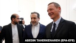 File photo - Iranian deputy foreign minister Abbbas Araqchi (Center) accompanies French envoy Emmanuel Bonne (Right) upon arrival for a meeting with Iranian foreign minister, in Tehran, Iran, 10 July 2019