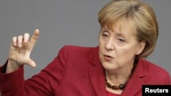 German Chancellor Angela Merkel also said no country in trouble should be "left on its own" in a crisis.