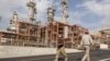 Iran -- Iranian workers walk at a unit of South Pars Gas field in Asalouyeh Seaport, north of Persian Gulf, November 19, 2015