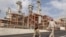 Iran -- Iranian workers walk at a unit of South Pars Gas field in Asalouyeh Seaport, north of Persian Gulf, November 19, 2015