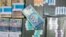 Tenge banknotes are seen at a bank branch in Almaty (file photo)