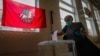 A Russian woman votes during early voting in a referendum on amendments to the Russian Constitution in Moscow on June 29.