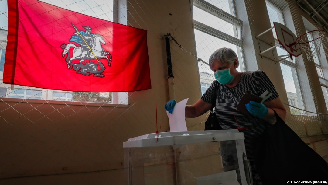 A Russian woman votes during early voting in a referendum on amendments to the Russian Constitution in Moscow on June 29.