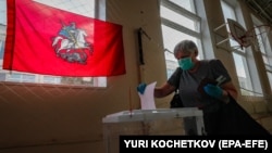 A Russian woman votes during early voting in a referendum on amendments to the Russian Constitution in Moscow on June 29.