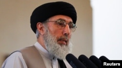 Gulbuddin Hekmatyar speaks during a welcoming ceremony at the presidential palace in Kabul on May 4.