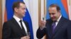 Russia - Russia's Prime Minister Dmitry Medvedev (L) and Armenia's Prime Minister Hovik Abrahamyan hold glasses of champagne during a ceremony of signing joint documents following Russian-Armenian talks, Yerevan, April 07, 2016