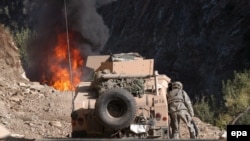 FILE photo of fighting in Waygal district in Afghanistan's Nuristan province.