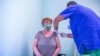 A woman receives the Russian Sputnik V vaccine at the South Pest Central Hospital in Budapest on February 12.