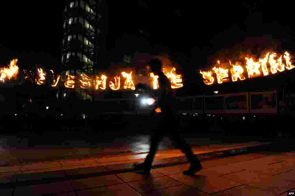 &nbsp;Members of the movement Vetevendosje (Self-Determination) set letters on fire reading &quot;Agreement With Serbia&quot; in front of the Kosovar government headquarters in Pristina. (AFP/Armend Nimani)