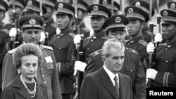 China -- Romanian President Nicolae Ceausescu (R) and his wife Elena in Beijing, October 14, 1988.