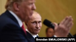 U.S. President Donald Trump (left) and Russian President Vladimir Putin talk to reporters in Helsinki on July 16.