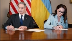 US Treasury Secretary Scott Bessant and Ukraine's First Deputy Prime Minister Yulia Svyrydenko sign the minerals agreement