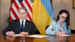 US Treasury Secretary Scott Bessant and Ukraine's First Deputy Prime Minister Yulia Svyrydenko sign minerals agreement. 