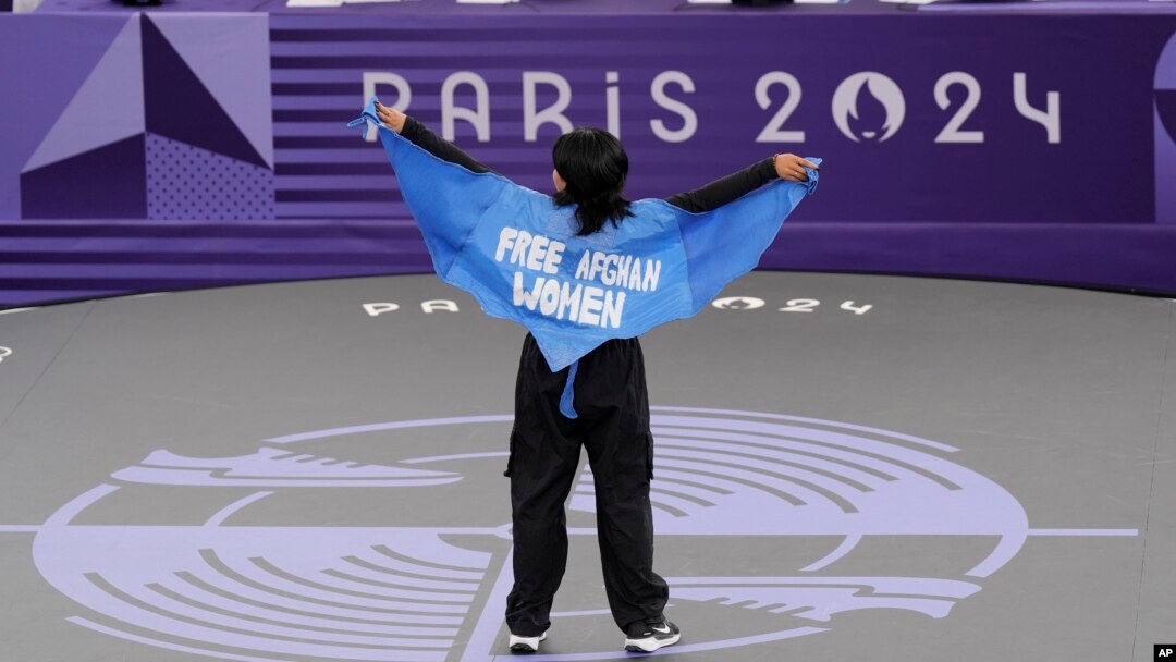 Afghan refugee breaker Manizha Talash wore a cape that said "Free Afghan Women" during her pre-qualifier battle in Paris on August 9.