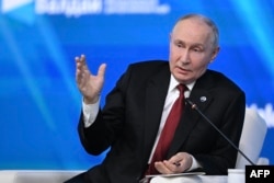 Russian President Vladimir Putin speaks at the Valdai Discussion Club in Moscow on October 1.