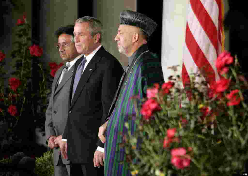 Pakistan President Pervez Musharraf (left), U.S. President George W. Bush (center), and Afghan President Hamid Karzai at the White House on September 27 (epa) - Afghan President Hamid Karzai sat down with RFE/RL in November to discuss relations between his country and Pakistan, among other things. Karzai announced that he had proposed a joint council that would bring together people from both sides of the border to discuss ways of eliminating the violence.