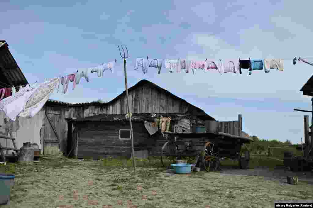 Clothes hang to dry in the yard of the Izhmukhametov family house in Sibilyakovo. Like many villages dotted across Russia, Sibilyakovo lost most of its population after the closure of its state-run collective farm following the 1991 collapse of the U.S.S.R.