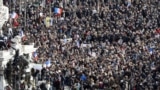 People gather on the Place de la Republique in Paris before the start of the march.