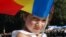 Moldova - a child with tricolor, military parade, Independence Day, Chisinau, 27Aug2011